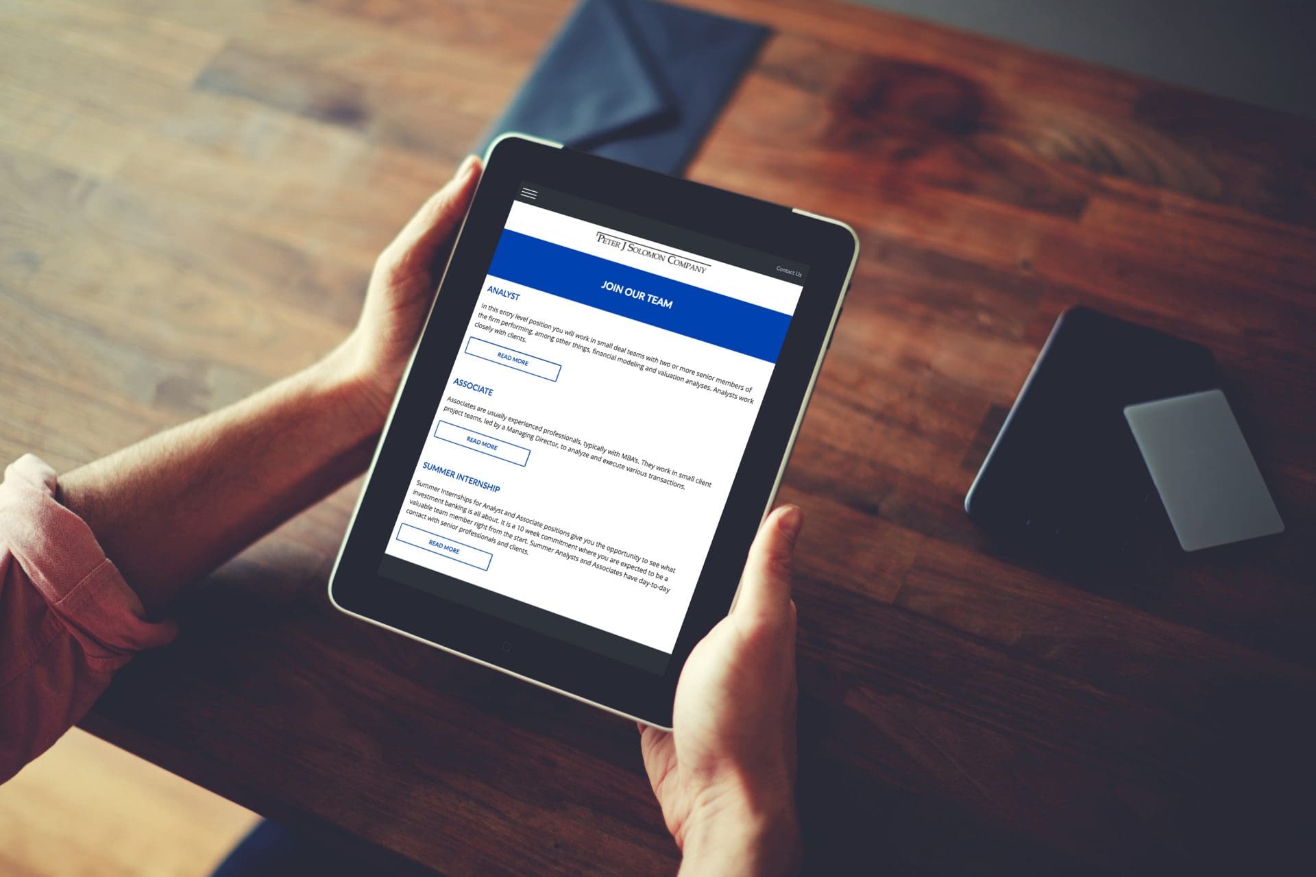 PJSC_mockup_holdingipad PJSC_mockup_holdingipad